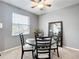 Cozy dining area with round table, four chairs, and a ceiling fan at 4041 Byrds Crossing Dr, Lakeland, FL 33812