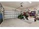 Spacious garage with ample storage space, lawn equipment and epoxy flooring at 4041 Byrds Crossing Dr, Lakeland, FL 33812