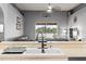 Kitchen sink with a view of living area and a beautiful fenced yard at 4041 Byrds Crossing Dr, Lakeland, FL 33812