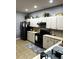 Efficient kitchen features matching appliances, tile backsplash, and ample counter space at 4041 Byrds Crossing Dr, Lakeland, FL 33812