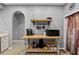 Kitchen area featuring a prep station with a butcher block top and open storage shelves at 4041 Byrds Crossing Dr, Lakeland, FL 33812