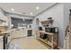Open concept kitchen with modern appliances, light cabinets, and an island prep station at 4041 Byrds Crossing Dr, Lakeland, FL 33812