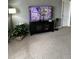 Living room features a TV and plant with decor on the wall at 4041 Byrds Crossing Dr, Lakeland, FL 33812