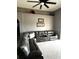 Spacious living room with a large gray sectional sofa and decorative shelving at 4041 Byrds Crossing Dr, Lakeland, FL 33812
