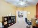 Spacious home office with multiple doorways, storage shelves, and neutral carpet flooring at 4041 Byrds Crossing Dr, Lakeland, FL 33812