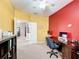 Bright home office with a complete desk set up, storage, and doorway to other rooms at 4041 Byrds Crossing Dr, Lakeland, FL 33812