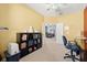 Bright home office featuring ceiling fan and view into dining area at 4041 Byrds Crossing Dr, Lakeland, FL 33812