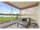 Inviting screened-in patio featuring a cozy seating area and open backyard views at 4041 Byrds Crossing Dr, Lakeland, FL 33812