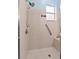 This tiled shower has a showerhead and a window above a built-in bench at 4041 Byrds Crossing Dr, Lakeland, FL 33812