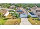 Picturesque aerial view of a well-maintained home with manicured lawn and established landscaping at 412 Emerald Cove Loop, Lakeland, FL 33813