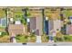 Aerial view of a neighborhood showcases well-maintained homes and green spaces at 412 Emerald Cove Loop, Lakeland, FL 33813