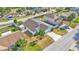 Aerial shot features a well-maintained home with a fenced backyard and mature trees at 412 Emerald Cove Loop, Lakeland, FL 33813