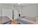 Bright bedroom with hardwood floors, ceiling fan and double door closets at 412 Emerald Cove Loop, Lakeland, FL 33813