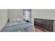 Bedroom with a bed, dresser, and natural light at 412 Emerald Cove Loop, Lakeland, FL 33813