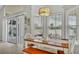 Dining area with natural light, a wooden table, and sliding glass doors to the backyard at 412 Emerald Cove Loop, Lakeland, FL 33813