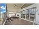 Enclosed lanai with tile flooring, ceiling fan, and natural light at 412 Emerald Cove Loop, Lakeland, FL 33813