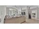 Open concept living space with a large sofa, vaulted ceilings, and a view into the dining area at 412 Emerald Cove Loop, Lakeland, FL 33813