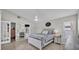 Main bedroom features a ceiling fan, neutral paint, and french doors to bathroom and closet at 412 Emerald Cove Loop, Lakeland, FL 33813