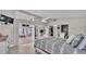 Large main bedroom features a tv, access to a screened patio, and access to the bathroom and closet at 412 Emerald Cove Loop, Lakeland, FL 33813