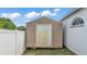 Exterior view of a storage shed with a side door in the backyard at 412 Emerald Cove Loop, Lakeland, FL 33813