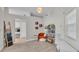 Cozy sitting area with a reading nook, tile floors, and natural lighting at 412 Emerald Cove Loop, Lakeland, FL 33813