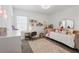 Charming bedroom with stylish decor, a comfortable bed, and plenty of natural light at 4122 Conjunction Way, Apopka, FL 32712