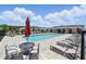 Beautiful community pool area with ample seating and lounge chairs, perfect for relaxation and recreation at 4122 Conjunction Way, Apopka, FL 32712