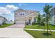 Beautiful two-story home with a well-maintained lawn and driveway at 4122 Conjunction Way, Apopka, FL 32712