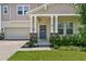 Charming home featuring a welcoming front door and manicured lawn at 4122 Conjunction Way, Apopka, FL 32712