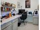 Well-organized home office with custom desk, ample shelving, and great lighting for productivity at 4122 Conjunction Way, Apopka, FL 32712