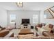 Bright living room with a large TV, comfortable seating, and a cozy atmosphere at 4122 Conjunction Way, Apopka, FL 32712
