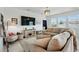 Cozy living room with comfortable seating, a TV, and natural light at 4122 Conjunction Way, Apopka, FL 32712