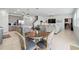 Open-concept living space combining the kitchen, dining area, and living room at 4122 Conjunction Way, Apopka, FL 32712