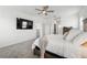 Comfortable main bedroom with a large TV and neutral tones at 4122 Conjunction Way, Apopka, FL 32712