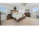 Spacious main bedroom with a ceiling fan, large bed, and natural light at 4122 Conjunction Way, Apopka, FL 32712