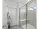 Modern bathroom featuring a sleek glass-enclosed shower with tiled walls at 4122 Conjunction Way, Apopka, FL 32712