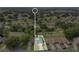 Aerial view of home in a beautiful community setting surrounded by green spaces and nearby amenities at 432 Sandestin Dr, Winter Haven, FL 33884