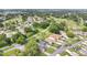 Aerial view of neighborhood with lush green landscaping and community golf course at 432 Sandestin Dr, Winter Haven, FL 33884