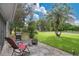 Patio with a lounge chair and grill, offering a spot to relax and enjoy the outdoors at 432 Sandestin Dr, Winter Haven, FL 33884
