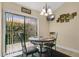 Cozy breakfast nook with outdoor view and decorative chandelier at 432 Sandestin Dr, Winter Haven, FL 33884