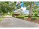 Welcoming community entrance featuring a guard house, manicured landscaping, and a secure gate for residents at 432 Sandestin Dr, Winter Haven, FL 33884