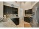 Modern kitchen featuring granite countertops, stainless steel appliances, and tiled backsplash at 432 Sandestin Dr, Winter Haven, FL 33884