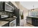 Bright kitchen with stainless appliances, tile floors, and an eat-in dining area at 432 Sandestin Dr, Winter Haven, FL 33884