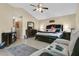 Spacious main bedroom with a king-size bed, vaulted ceiling, and seating area at 432 Sandestin Dr, Winter Haven, FL 33884