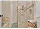 Walk-in shower features tiled walls, rainfall shower head, and built-in shelving at 432 Sandestin Dr, Winter Haven, FL 33884