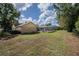 Lush backyard with manicured lawn and fenced pool area, great for outdoor activities at 4825 Luce Rd, Lakeland, FL 33813