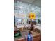 Chic bar area with glass shelving, granite countertops, a stainless sink, and decorative bottles at 4825 Luce Rd, Lakeland, FL 33813