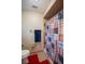 Bathroom featuring a shower with colorful patchwork curtain and red rug at 4825 Luce Rd, Lakeland, FL 33813
