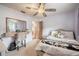 Bright bedroom featuring a fan, large window, and comfortable bed at 4825 Luce Rd, Lakeland, FL 33813