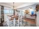 Open concept breakfast nook with a view of the living area featuring a fireplace and neutral furnishings at 4825 Luce Rd, Lakeland, FL 33813